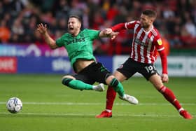 Nick Powell of Stoke City tackled by Oliver Norwood of Sheffield United: Simon Bellis / Sportimage