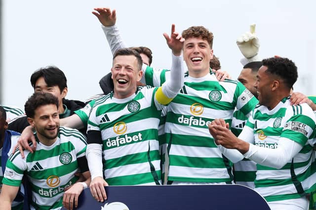 Callum McGregor (second left) leads the Celtic celebrations at Tannadice after another Premiership title triumph (Photo by Craig Foy / SNS Group)