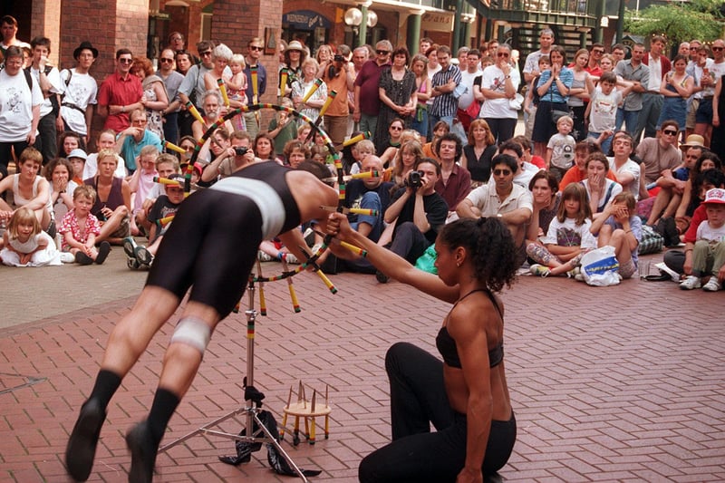 The final of a street entertainer's contest was held in Orchard Square, Sheffield during Euro 96. Gato Prato perform their daring act in front of the crowd
