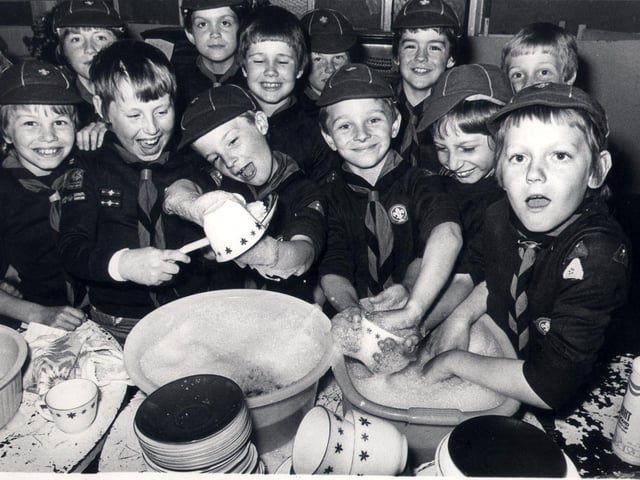 Members of the 74th Sheffield (Heeley) cub scouts buckle down to a sponsored dish-washing session at Heeley Parish Church Hall on June 12, 1979