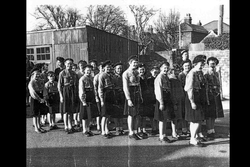 The 1st Bedhampton guides prepare for a parade in 1959 or 1960