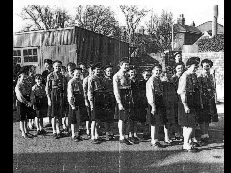 The 1st Bedhampton guides prepare for a parade in 1959 or 1960