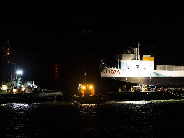 LCT 7074 is carried on the barge and sailed into position. Picture Credit: Keith Woodland