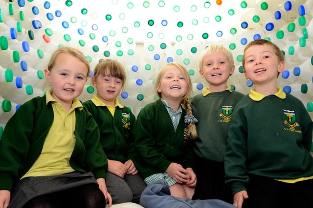 The new reception class pupils at  Lowick and Holy Island First Schools in their igloo created from milk bottles.