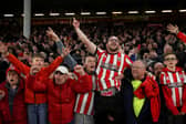 Sheffield United fans celebrate after winning promotion to the Premier League: George Wood/Getty Images