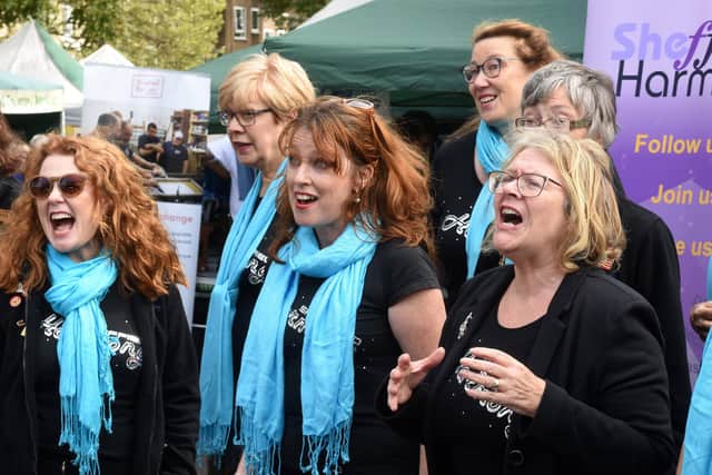 Members of Sheffield Harmony perform at the Nether Edge Farmers' Market in 2018