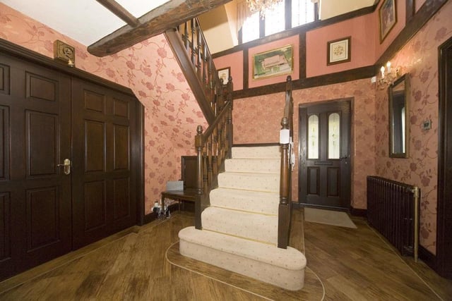 The spindles staircase in the entrance hallway leads to the first floor of the house.