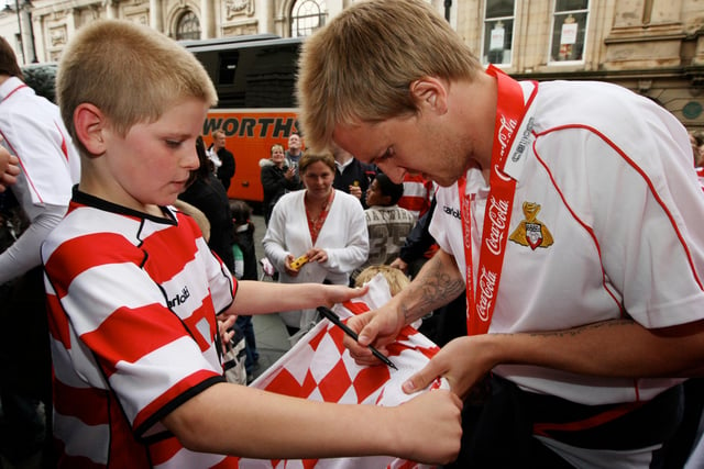 James Coppinger signs autographs for his fans outside the Mansion House