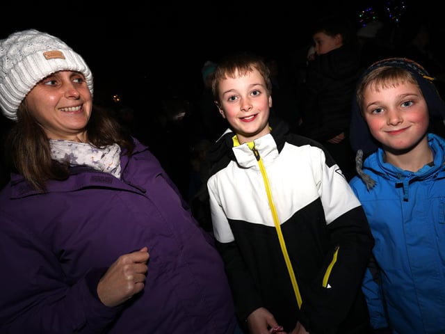 From left, Rachel Meller with her boys, Ewan, 11, and Toby, 8. Emsworth Christmas lights switch on, St Peter's Square, Emsworth
Picture: Chris Moorhouse (jpns 031221-47)
