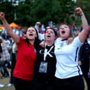 England fans at Devonshire Green celebrate as they watch a screening of the UEFA Women's Euro 2022 semi-final match between England and Sweden held at Bramall Lane, Sheffield. Isaac Parkin/PA Wire.