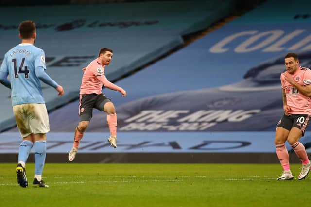 John Fleck of Sheffield Utd  shoots just wide during the Premier League match at the Etihad Stadium, Manchester. Picture date: 30th January 2021. Picture credit should read: Simon Bellis/Sportimage