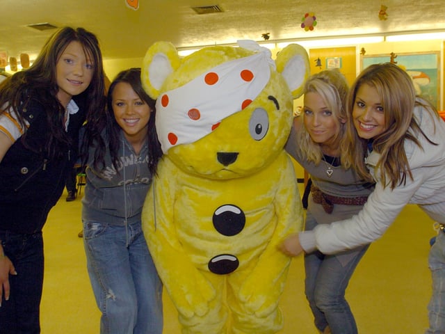 Pudsey is pictured posing with Nicola Roberts, Kimberly Walsh, Sarah Harding and Cheryl Cole - four out of five members of former girl band Girls Aloud (Photo: JPIMedia)
