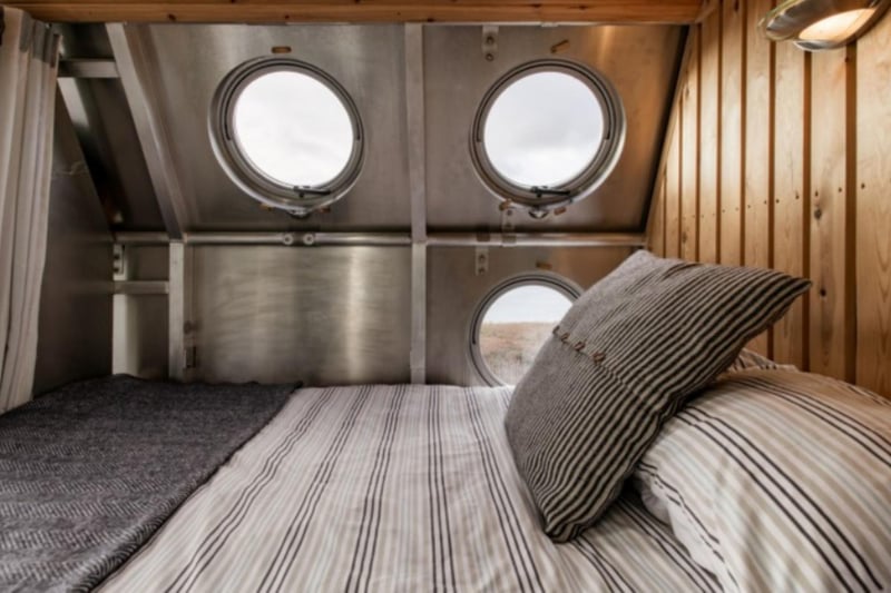 Enjoy views from the porthole windows from a comfy kingsize bed.