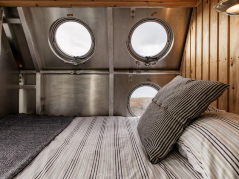 Enjoy views from the porthole windows from a comfy kingsize bed.