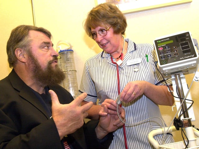 Mexborough born Actor Brian Blessed returned to South Yorks to open the, Chatsfield Suite, Doncaster Royal Infirmary's new Chemotherapy Unit in 2002. Pictured is Brain with Joyce Burman a Clinical Nurse Specalist at the centre