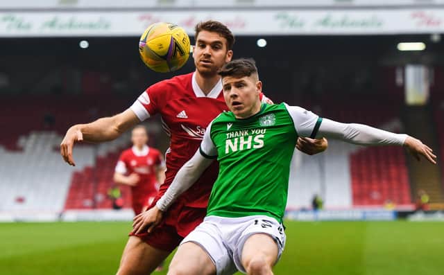 Hibs' Kevin Nisbet (right) holds off Tommie Hoban of Aberdeen