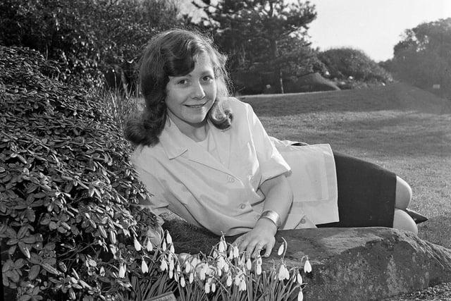 19-year-old Helena Mary Turner, of Inverleith Row, with the first snowdrops of the season at the Botanic Gardens in February 1964.