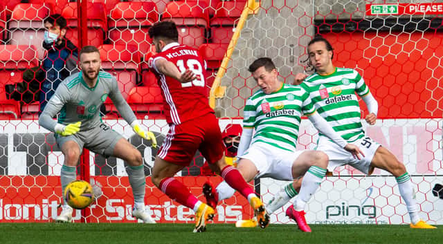 Callum McGregor brings down Connor McLennan in stoppage-time as Aberdeen enjoy a share of the spoils with Celtic. Picture: SNS