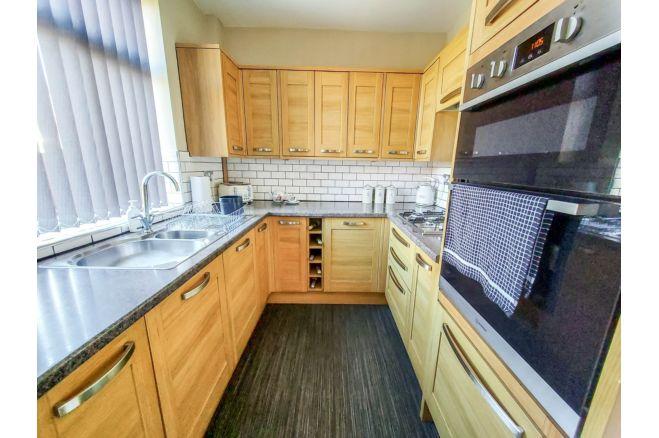 The fitted kitchen diner looks well-equipped for a family.