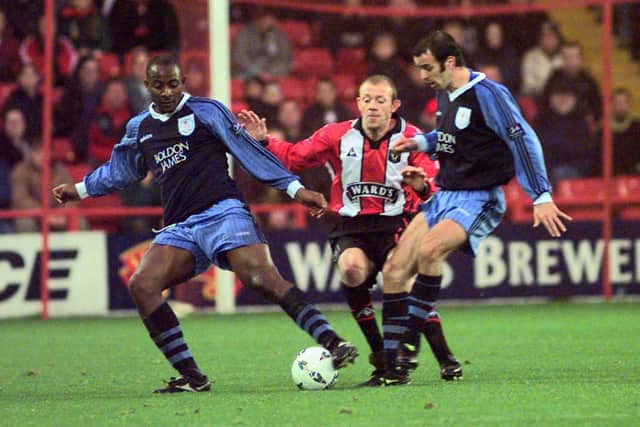 Sheffield United's Mark Patterson closed out by Dele Adebola , left