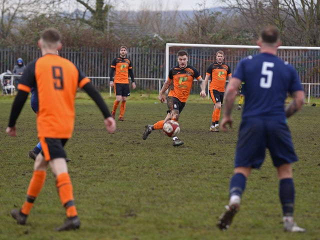 Scawthorpe’s Joe Byron, centre, is focused on the ball.