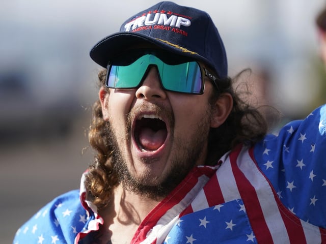 A supporter of President Donald Trump shouts during a rally outside the Maricopa County Recorder's Office. (AP Photo/Ross D. Franklin)