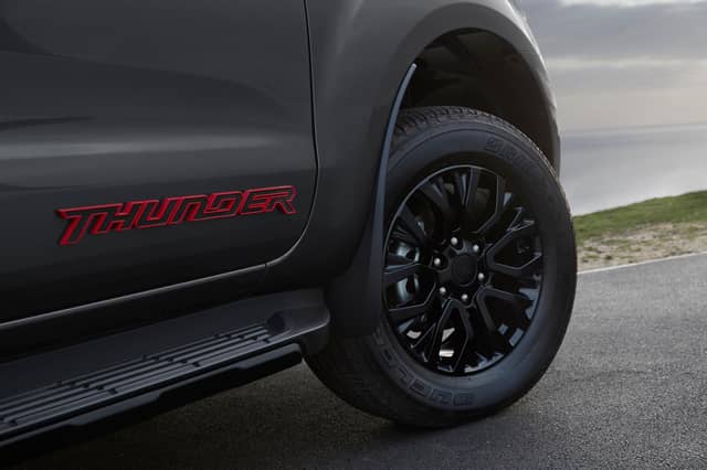 Exterior details include 18-inch black alloy wheels, 3D-effect Thunder detailing on the wings and tailgate, a bespoke 'sea grey' paint and red highlights