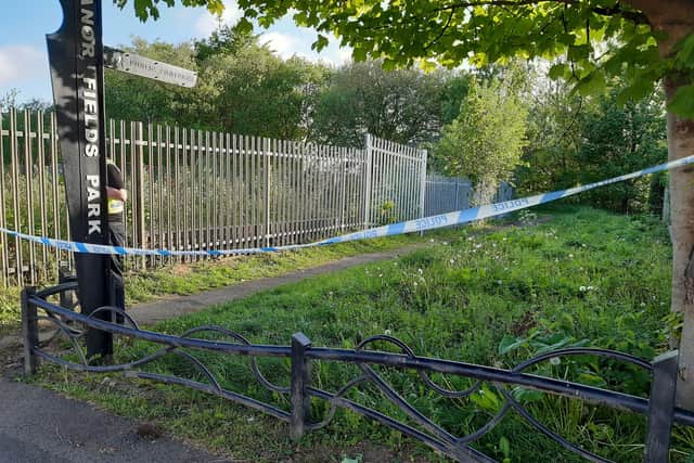 A grassy path sealed off this morning by police, after a body was found at Manor Fields Park