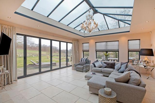 The house offers reception rooms that flow in order to create light and spacious entertaining areas