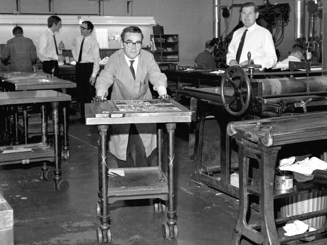 Composited pages of The Scotsman are taken from the caseroom to be moulded onto the presses at North Bridge in September 1966.