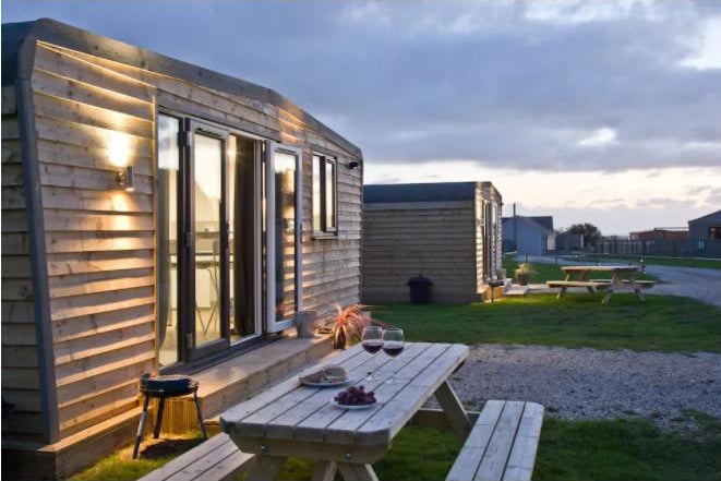 This is a beautiful wooden lodge in Helston, just 3 miles from Porthleven. Featuring a fitted kitchen and shower room. Tastefully decorated and furnished, it is the perfect size for a family of 4 with the option of a couple of extra guests on a fold out sofa bed. Wheal Rose Lodge is situated on a picturesque golf course with beautiful, distant sea views. Set in a peaceful setting with few neighbouring houses, however, the local town and shops are a mere 5 minute drive away so you have everything you need within easy reach.
Close to lots of National Trust walks and beaches, as well as historical Poldark Mine is a tourist attraction near the town of Helston in Cornwall. Not a bad deal with prices starting from £124 per night or a two night stay for £248 from April 18-20.
Book via Airbnb.