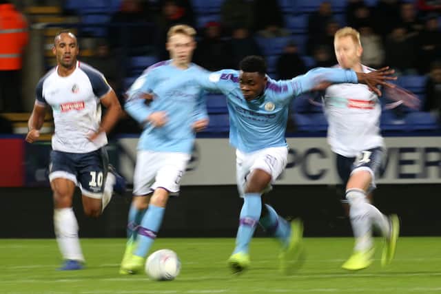 BOLTON, ENGLAND - OCTOBER 29: Fisayo Dele-Bashiru of Manchester City U21s in possession during the Leasing.com Trophy match between Bolton Wanderers and Manchester City U21s at the University of Bolton Stadium on October 29, 2019 in Bolton, England. (Photo by Lewis Storey/Getty Images)