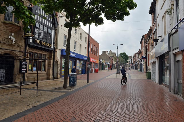 A lone cyclist in the town centre