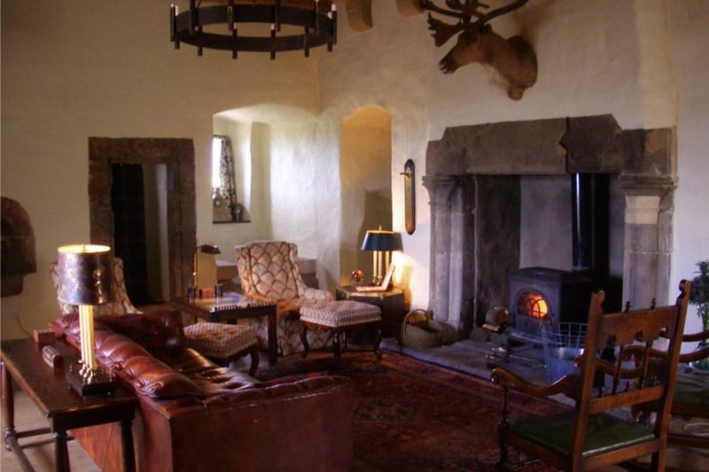 The Great Hall features a wood burner and comfortable furniture.