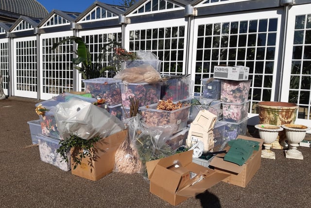 Activity centred on the listed glasshouses where production staff were setting up what looked like a market scene including boxes of flowers seen here.