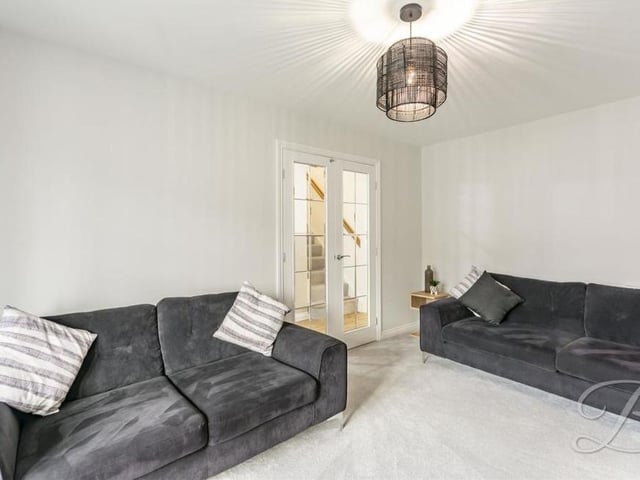 Another shot of the living room, which is welcoming and airy. Catch up with family and friends to watch the latest movie, or simply enjoy a chat.