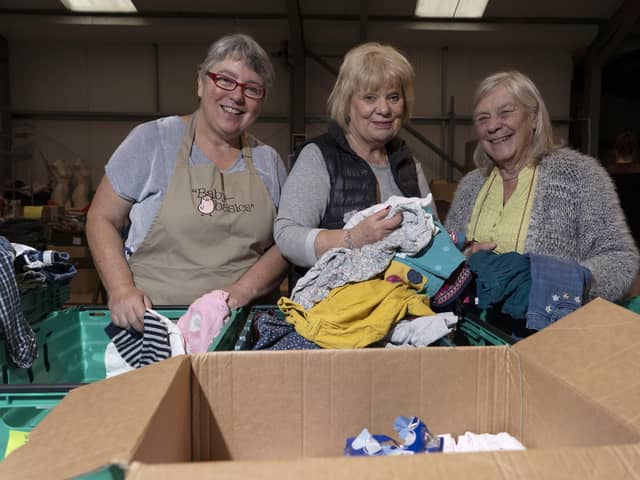 Maggie Hanson, Gill Manifold and Joy Tanner at Baby Basics UK pack baby equipment for Afghan refugee families across the UK.  Picture Scott Merrylees