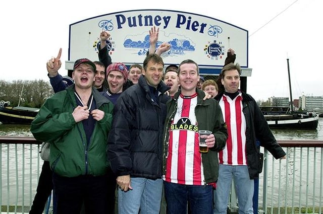 Blades fans at Putney Pier after their booze cruise down the Thames. Ex blades hero Bob Booker and cruise organiser Andy Bonell, centre, in jubilant mood before United's crushing 4-0 defeat at Fulham, on April 15, 2000