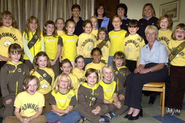 Brownie District Commissioner Jo taylor (seated right) pictured with the 22 Brownies of the 152nd Sheffield (Oughtibridge) who took their oath in front of parents and friends at the Worrall memorial Hall in 2003