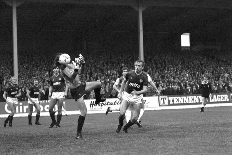Hearts goalkeeper Henry Smith fumbles the ball but team-mate Walter Kidd is there to back him up during the Hibs v Hearts Edinburgh derby football match at Easter Road, November 1985.