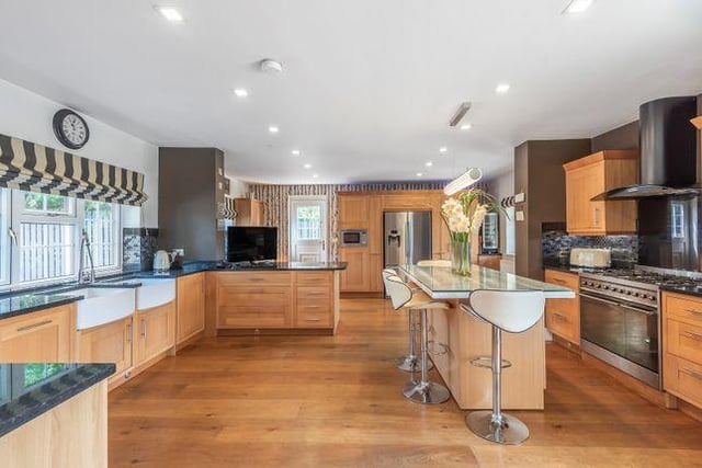 The kitchen is large, with a separate breakfast island and plenty of worktop space