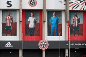 Posters of NHS workers and SHeffield United fans Yvonne Lait and Matt Cotton have gone up on the side of Bramall Lane alongside Billy Sharp and David McGoldrick. Pic: SUFC