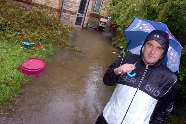 Lee Neath outside his Whittington Street, Doncaster, rented home which is surrounded by flood water. It was flooded during the last heavy downpour of rain, and he was expecting it to be flooded once again in 2007