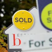 Sold and for sale signs as house prices in Sheffield defy a drop in the national market