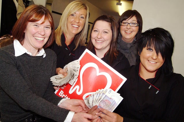 Fundraising hairdressers from D 'n' G 's Hair Salon in Mansfield, hand over the proceeds of a hair show, totalling £681, to BHF's Helena Mair, left.  The 2008 show was organised and held at the Rosemary Street salon as part of stylist Alyson Meikle's NVQ level 3 exam.  Pictured are from left, Helena Mair, Debbie Simkins owner, Alyson Meikle, NVQ assessor Laura Sneddon and Roxy Hall.