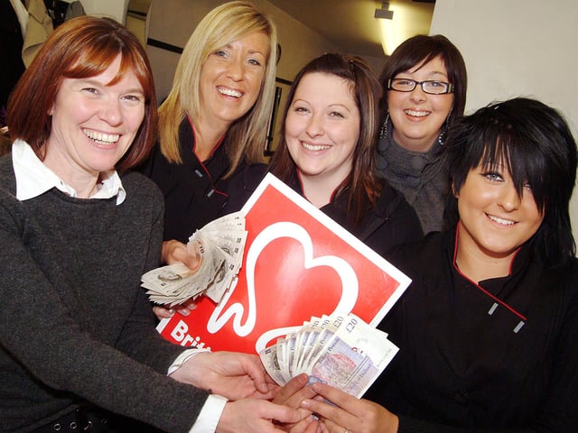 Fundraising hairdressers from D 'n' G 's Hair Salon in Mansfield, hand over the proceeds of a hair show, totalling £681, to BHF's Helena Mair, left. The 2008 show was organised and held at the Rosemary Street salon as part of stylist Alyson Meikle's NVQ level 3 exam. Pictured are from left, Helena Mair, Debbie Simkins owner, Alyson Meikle, NVQ assessor Laura Sneddon and Roxy Hall.