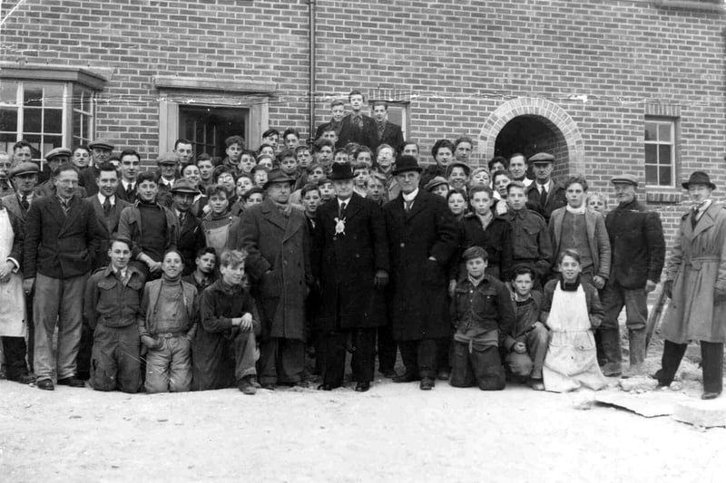 Sent in by Jack Sexton of Hilsea, we see boys of the Apprentices Training Scheme in Peterborough Road, Wymering in 1946.
The building was put to use to train 14 year old boys for 9 months to see if they were of any use in the building trade.
Jack is to the right kneeling down wearing the painters apron.
Some of the adults are Instructor J. Nicholls, Alderman Allaway and John Lay Chairman of Apprenticeship Council.