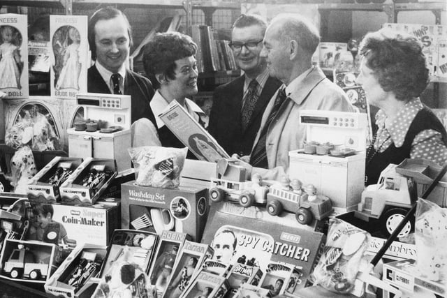 Employees at Plessey Telecommunications factory used the money they collected to buy toys for children in need in 1974.