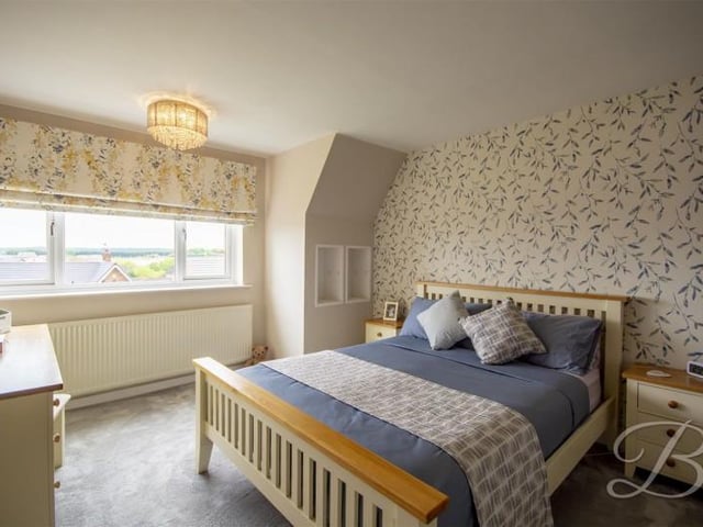 The master bedroom has great views and fitted wardrobes.