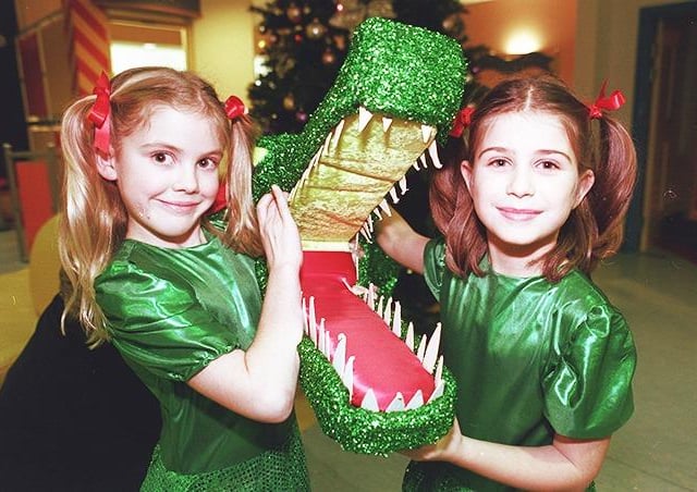 Polly Noble, and Sophia Stones (both 8) of the June Gill School of Dancing, pictured with the crocodile that has been donated to the Sheffield Children's Hospital, on December 9, 1999